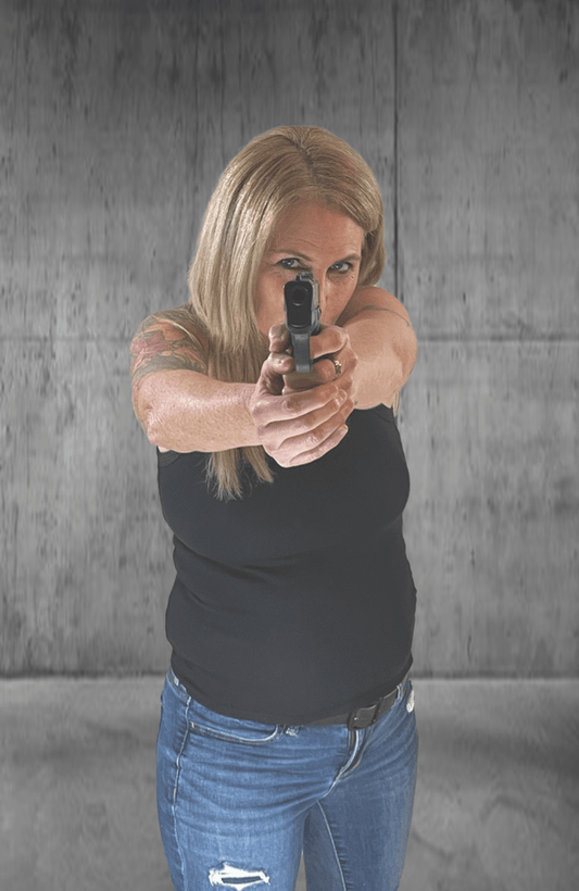 Woman aiming a handgun.