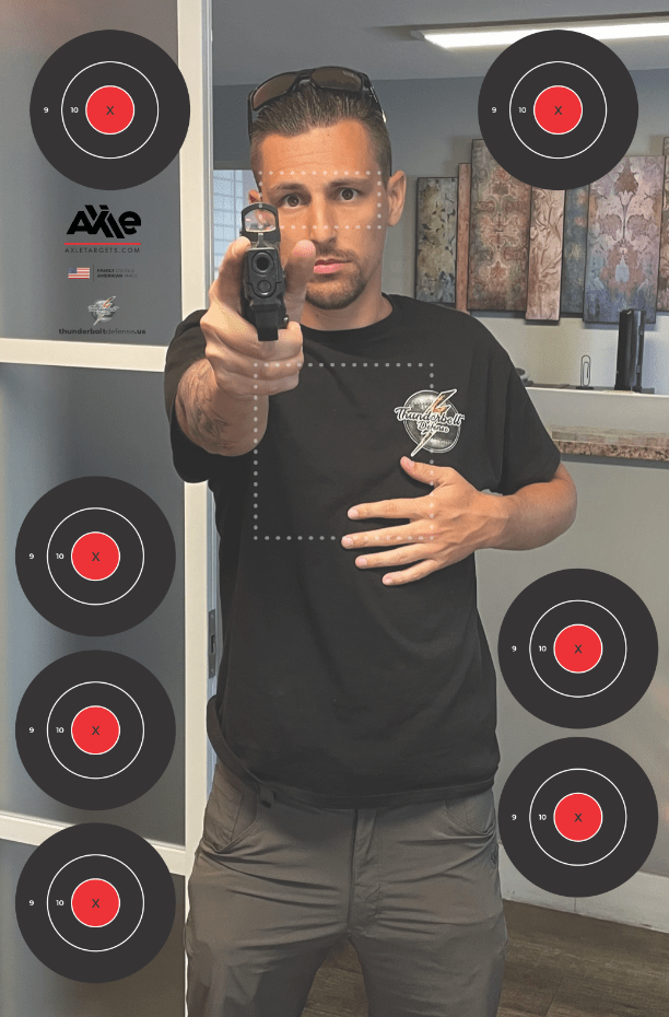 Photo-realistic paper target of a man in a Thunderbolt Defense shirt aiming a pistol, ringed by seven scoring bullseyes