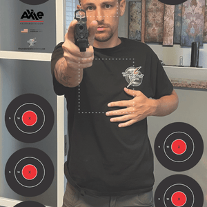 Man aiming gun at target, screenshot from 2022 training session.